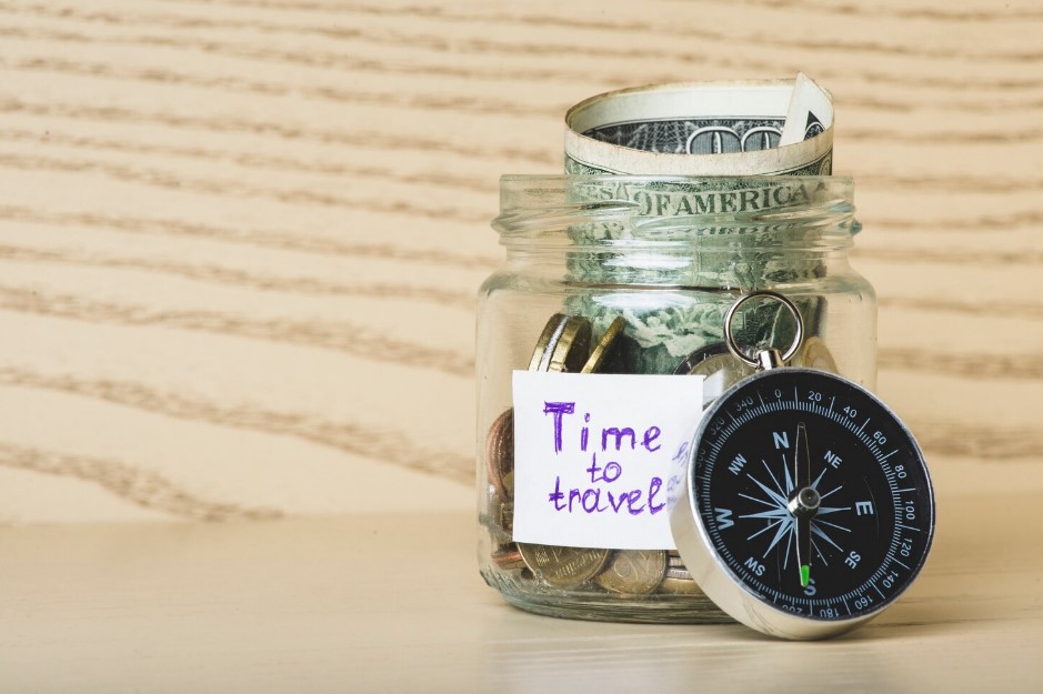  Wooden surface with money and compass