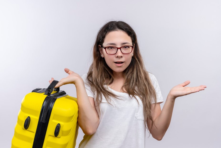 girl holding travel suitcase 