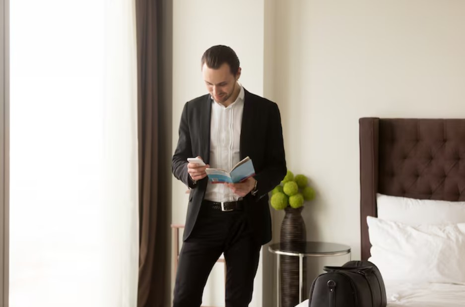 Businessman holds guide brochure