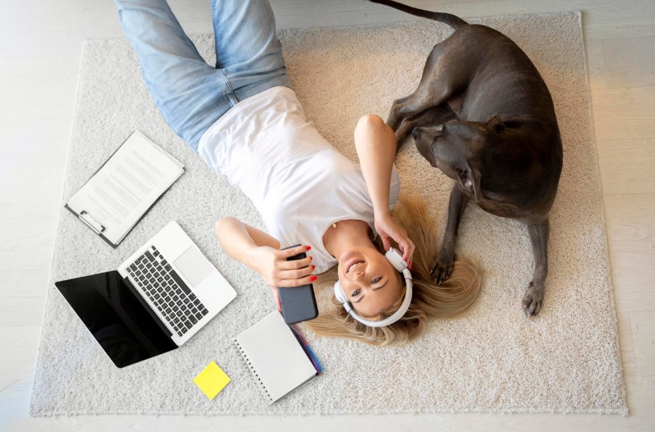 Medium shot woman wearing headphones with dog