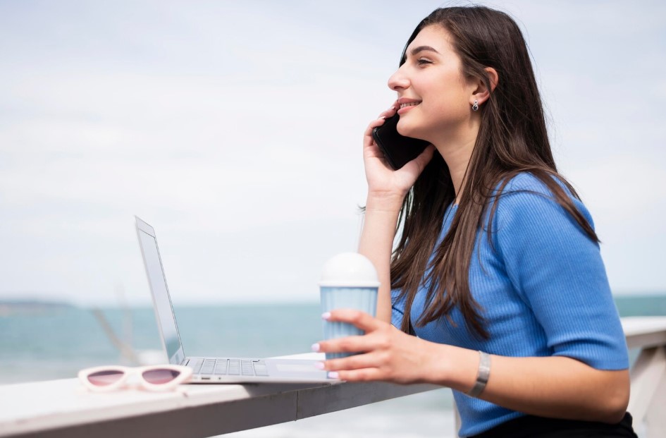 Side view of woman working at the beach