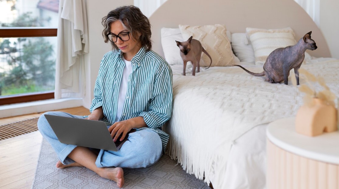 Full shot senior woman with cat at home