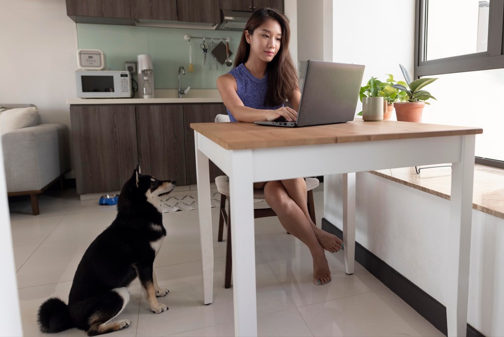Full shot woman working remotely