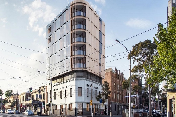 An Art Deco heritage pub in Melbourne, will be the site of a new eight storey hotel which will provide short-term accommodation for nurses visiting Melbourne for conferences, training and meetings.&nbsp;The purpose of the redevelopment will be to accommodate interstate and international nurses for short visits to conferences and professional development in Melbourne. About a third of the 86,000 nursing union members reside in regional Victoria.

The Central Club Hotel on Victoria St was purchased by&nbsp;The Australian Nursing and Midwifery Federation&nbsp;in 2017.&nbsp;The Federation purchased the building for nearly $9 million. The Central Club Hotel itself has been run by two local brothers for the past 40 years.

&nbsp;The group plan to bring back the hotel&rsquo;s former glory with an added eight storey residential hotel overlooking Queen Victoria Market, with 33 rooms, a rooftop terrace and garden.

Objectors to this project were concerned the excessive height of the development would overshadow The Queen Victoria Market and block views of neighbouring apartments.&nbsp;

However the&nbsp;City of Melbourne&nbsp;has decided to grant a permit, with conditions, to keep the pub on the ground floor, partially demolish the existing building and retain the street facing heritage fa&ccedil;ade.&nbsp;

&ldquo;The existing Central Club Hotel building will be restored and refurbished to highlight and celebrate its heritage features,&rdquo; a council report stated.

&ldquo;The use of heritage paint colours and replacement of like for like window and door furnishings will create an attractive and appropriate street frontage along Victoria and O&rsquo;Connell Streets.&rdquo;

Levels two to seven will be one bedroom apartments available for short-term accommodation for rural and regional nurses visiting the city for workshops, seminars and conferences. Nearby hospitals include the Royal Melbourne Hospital, Royal Children&#39;s Hospital and St Vincent&#39;s Hospital.

According to the council report, &ldquo;The retention of the heritage building and the creation of a highly considered upper level facade creates a positive architectural addition to the changing public realm.&rdquo;
