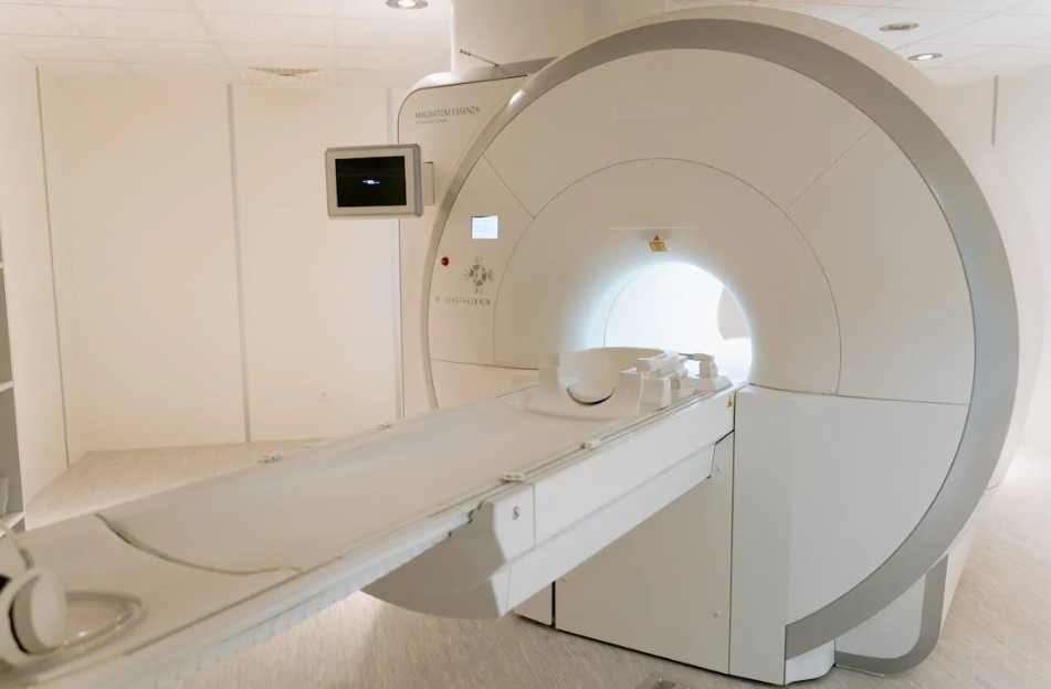 Residents in Australia&rsquo;s regional and remote communities often face long waits&mdash;or dangerous transfers&mdash;to reach hospitals equipped with CT scanners. But a new initiative led by Monash University&rsquo;s Design Health Collab, together with Micro‑X and Johns Hopkins University, promises to bring full-body imaging directly to remote towns and clinics.

Why This Matters

Access to CT scans can mean the difference between life and death&mdash;especially for head trauma, stroke, cancer follow-up, or internal injuries. Yet most rural health centres lack this capability, forcing patients to endure lengthy, risky trips to major hospitals.

As Sue Carroll, the nurse manager at Swifts Creek Bush Nursing Centre (nearly 400 km from Melbourne), puts it:

&ldquo;Time is critical&hellip; you need them moved immediately.&rdquo;

This new lightweight CT scanner is specifically designed to tackle that delay and disruption.

The Innovation: Compact, Vehicle-Compatible CT


	Weighing just 225 kg, the scanner uses Micro‑X&rsquo;s Nano Electronic X-ray (NEX) technology. That&rsquo;s a drastic reduction compared to traditional CT scanners&mdash;typically over 2 tonnes.
	By contrast, existing mobile CT trailers weigh hundreds of kilograms and require large vehicles and infrastructure. This compact design enables CT hardware to fit inside standard-sized vans or ambulances.


The lightweight design doesn&rsquo;t sacrifice quality, using carbon nanotube emitter technology to deliver high-resolution, hospital-grade scans, even at lower radiation doses.

How It Works in Practice

This model can operate in two ways:


	On-demand mobile units, akin to ambulance callouts.
	Scheduled regional rotations, like breast-screening vans, visit remote communities to provide regular diagnostic scans.


Clinics in towns like Omeo and Swifts Creek could then access CT imaging without long-distance transfers.

Patients and community leaders enthusiastically support this innovation&mdash;and see its broad potential.

Global &amp; Policy Support

The project is funded by a US$16.4 million (&asymp; A$25 million) contract from the ARPA‑H PARADIGM program, aimed at scaling rural healthcare delivery through mobile platforms. Monash University is one of twelve international teams selected.

While the current design is targeted at U.S. clinical trials (beginning as early as 2029), Monash researchers express strong interest in adapting the technology for Australian deployment.

Why It Matters for Outback Healthcare

Australia&rsquo;s &quot;postcode health inequality&quot; is stark: fewer than 20% of radiologists and 17% of imaging technologists practice outside major cities. Rural residents can wait three to six hours longer for imaging, especially after strokes&mdash;delays that significantly impact recovery outcomes.

If implemented locally, the lightweight CT scanner could:


	Reduce out-of-town transfers and delays
	Provide early detection for diseases like cancer or head injuries
	Enable non-specialist clinicians to operate imaging&mdash;with minimal training
	Bring consistency and equity to healthcare access across Australia


Challenges &amp; Next Steps

While the potential is huge, a few factors remain to be addressed:


	Clinical validation of image quality and diagnostic reliability compared to hospital CT units
	Radiation safety protocols and licencing for operating in field settings
	Power and connectivity infrastructure in rural areas
	Training of generalist operators, given scarce specialist staffing in remote towns


Dr Nyein Chan Aung from Monash&rsquo;s Design Health Collab emphasises that the scanner is being rebuilt from the ground up&mdash;with design tailored for clinical use by generalists in austere environments.

Looking Ahead

By 2029, ARPA-H trials in the U.S. will begin. With strong interest from Australian public health systems, the technology may arrive Down Under within the next few years&mdash;if partnered with funding and regulatory support.

If it achieves clinical rollout in regional Australia, the scanner could be integrated into:


	Mobile clinics and screening vans
	Helimed units and ambulances equipped for stroke care
	Pop-up diagnostic services in remote communities


This innovation holds the promise of ending the days when living in a rural postcode equals compromised healthcare access.

The development of this ultra-light mobile CT scanner is a breakthrough for healthcare access&mdash;and a model for bridging the gap between hospital services and remote communities. With continued partnerships and funding, Australia may soon witness hospital-level diagnostic care delivered directly into the bush.

To fully realise this vision, collaboration will be essential&mdash;not only between technology developers and healthcare providers, but also across state and federal health departments. Partnerships that include logistical support and investment in hospital stay accommodation near regional hubs will also be key. These accommodations allow families of rural patients to stay close during treatment, bridging another critical gap in the care journey.
